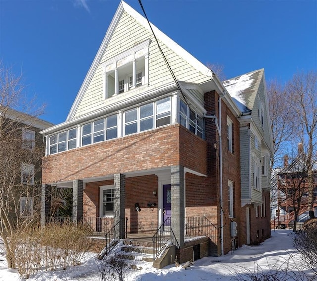 view of front of home with brick siding