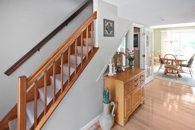 1504 Huckleberry Ct Unit 1504, Peabody, MA 01960 - staircase with wood finished floors, a chandelier, and baseboards