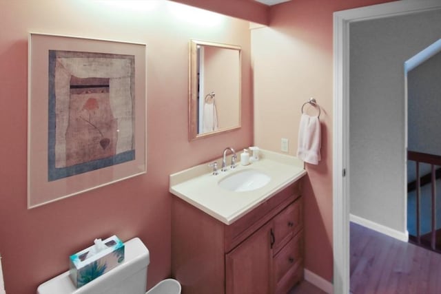 1504 Huckleberry Ct Unit 1504, Peabody, MA 01960 - bathroom with toilet, vanity, baseboards, and wood finished floors