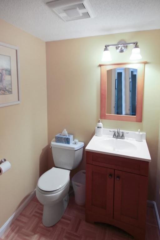 1504 Huckleberry Ct Unit 1504, Peabody, MA 01960 - bathroom featuring toilet, vanity, and a textured ceiling