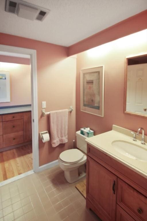 1504 Huckleberry Ct Unit 1504, Peabody, MA 01960 - half bath featuring vanity, toilet, and tile patterned flooring