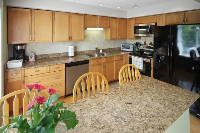 1504 Huckleberry Ct Unit 1504, Peabody, MA 01960 - kitchen with stainless steel appliances, a sink, light stone countertops, light wood-type flooring, and recessed lighting