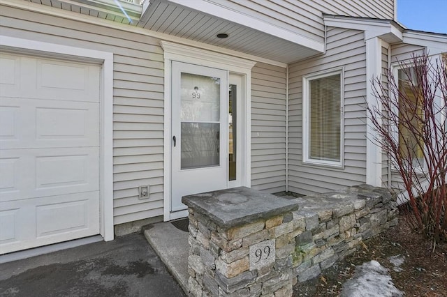 property entrance featuring a garage