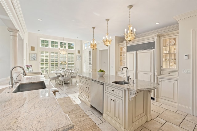 kitchen with a sink, cream cabinetry, dishwasher, and a notable chandelier