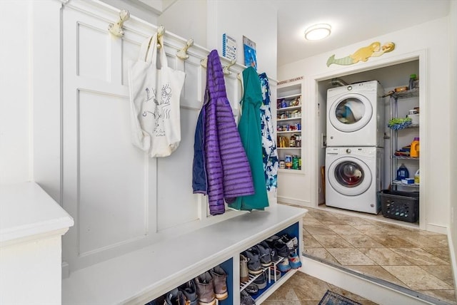 washroom with laundry area and stacked washer / drying machine