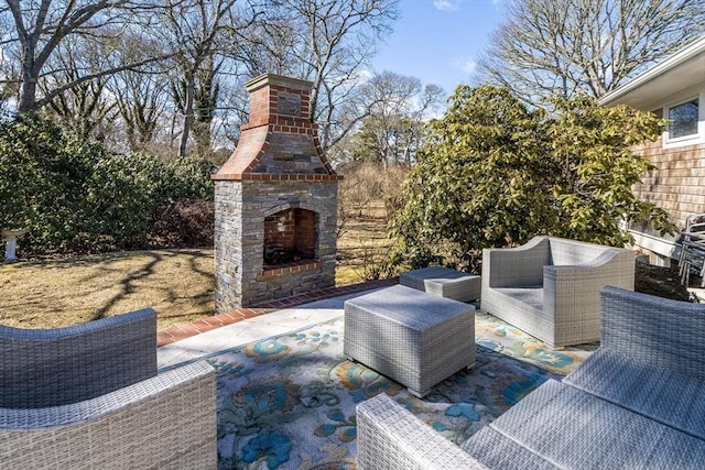 view of patio / terrace with exterior fireplace