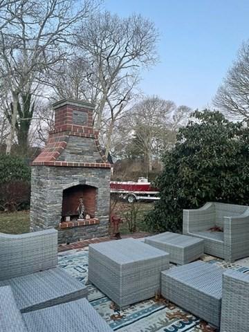 view of patio featuring an outdoor living space with a fireplace