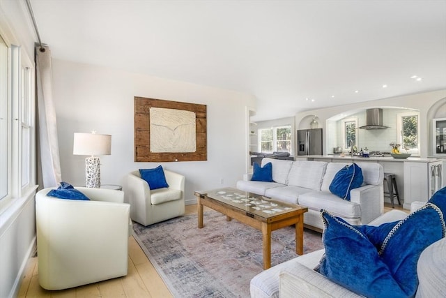 living area featuring recessed lighting and light wood-type flooring