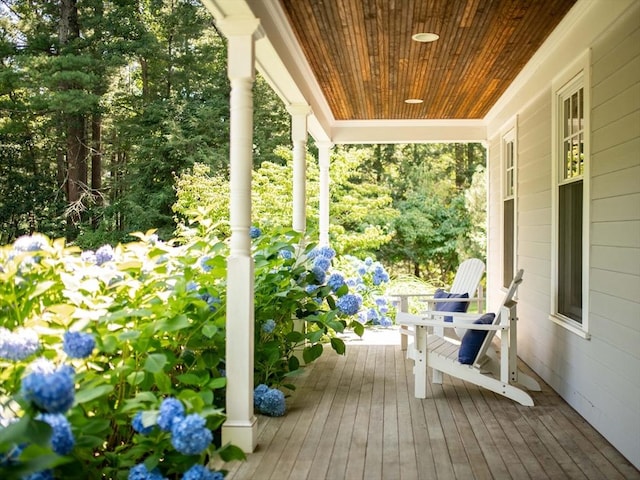 wooden terrace featuring covered porch
