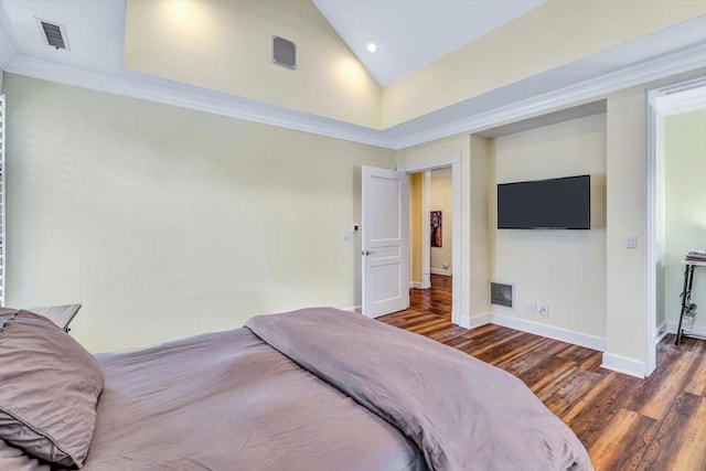 bedroom featuring crown molding, dark hardwood / wood-style floors, and high vaulted ceiling