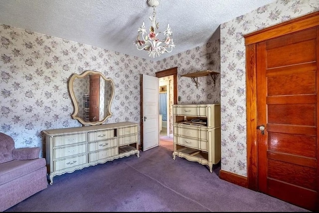 2 Leicester St, Oxford, MA 01537 - bedroom featuring a textured ceiling, wallpapered walls, a notable chandelier, and dark colored carpet