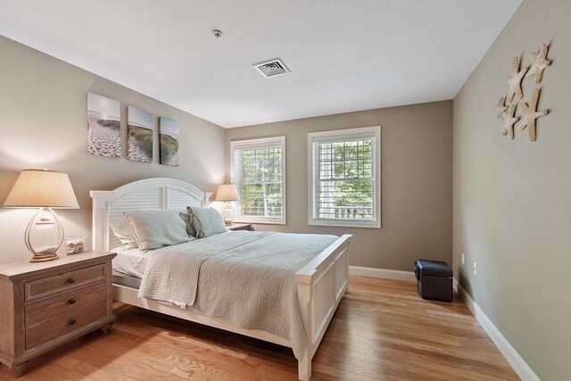 4 Sterling Hill Ln Unit 424, Exeter, NH 03833 - bedroom with light wood-style flooring and baseboards
