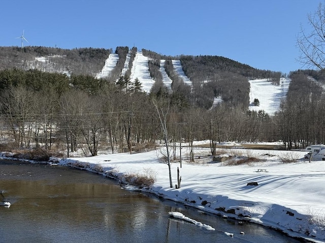 property view of mountains featuring a wooded view