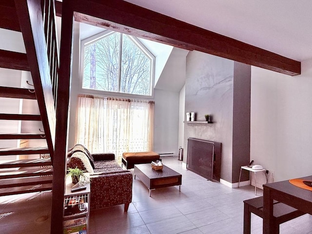 living room with a large fireplace, baseboards, beamed ceiling, a towering ceiling, and a baseboard radiator