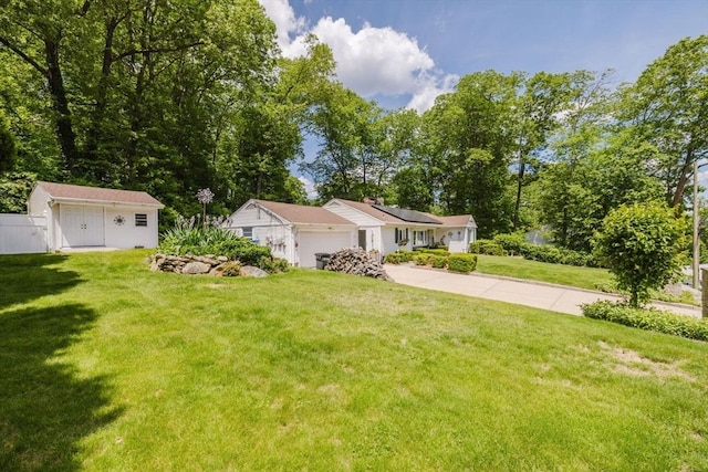 35 Williams St, Lincoln, RI 02865 - view of yard with a garage and concrete driveway