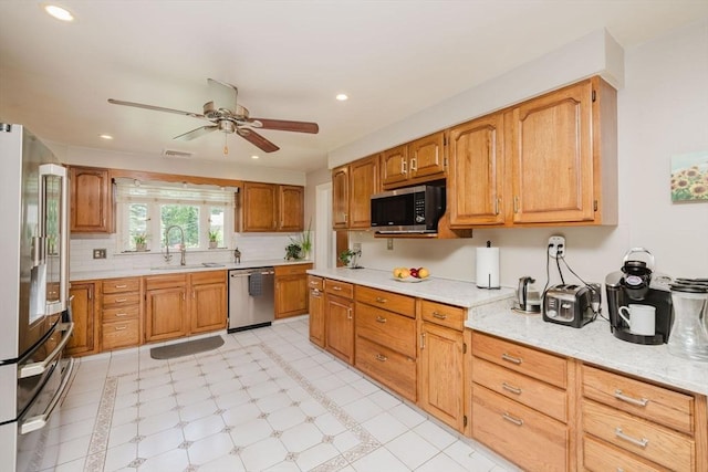 35 Williams St, Lincoln, RI 02865 - kitchen featuring stainless steel appliances, a ceiling fan, a sink, recessed lighting, and backsplash