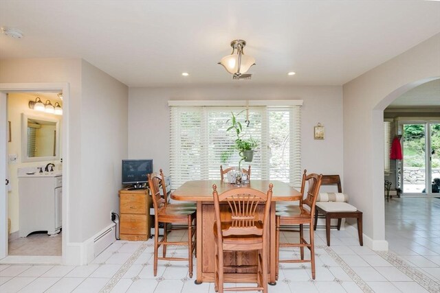 35 Williams St, Lincoln, RI 02865 - dining room with arched walkways, recessed lighting, baseboards, and a baseboard radiator