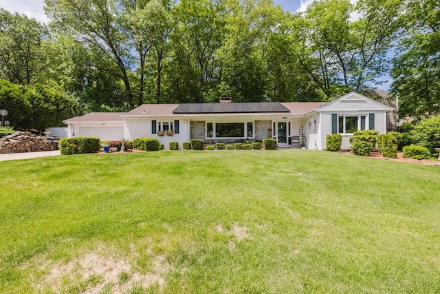 35 Williams St, Lincoln, RI 02865 - ranch-style house featuring solar panels, a front lawn, a garage, and a chimney