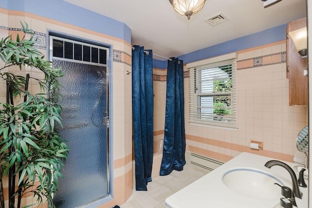 35 Williams St, Lincoln, RI 02865 - full bath with a baseboard heating unit, a sink, and tile patterned floors