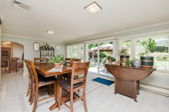 35 Williams St, Lincoln, RI 02865 - dining area featuring baseboard heating, ornamental molding, and arched walkways