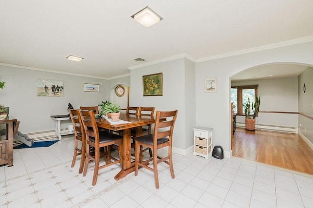 35 Williams St, Lincoln, RI 02865 - dining room with arched walkways, a baseboard heating unit, ornamental molding, baseboards, and baseboard heating