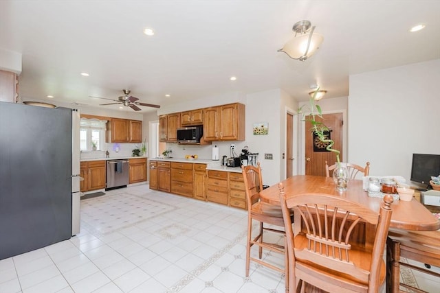 35 Williams St, Lincoln, RI 02865 - kitchen featuring appliances with stainless steel finishes, light countertops, a ceiling fan, recessed lighting, and brown cabinets