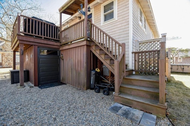 exterior space featuring a deck and stairs