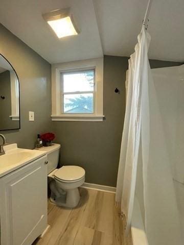 36 Circle St, Templeton, MA 01436 - bathroom with wood finished floors, toilet, vanity, and a shower with curtain