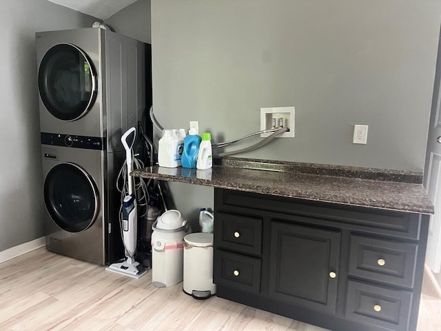 36 Circle St, Templeton, MA 01436 - laundry room with stacked washer / dryer, light wood-style flooring, and baseboards