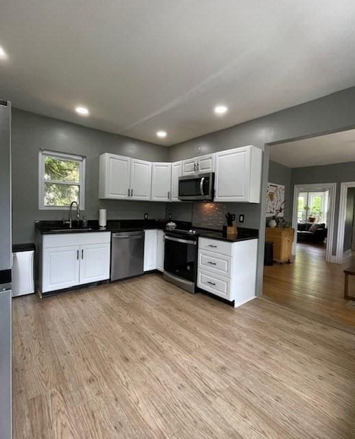 36 Circle St, Templeton, MA 01436 - kitchen featuring stainless steel appliances, dark countertops, light wood-style floors, and recessed lighting