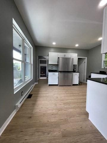 36 Circle St, Templeton, MA 01436 - kitchen featuring freestanding refrigerator, white cabinetry, dark countertops, light wood-style flooring, and baseboards