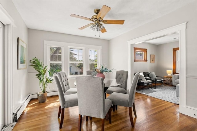 15 Newland Rd, Arlington, MA 02474 - dining area featuring light wood-style flooring, a baseboard heating unit, and a ceiling fan