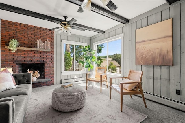 15 Newland Rd, Arlington, MA 02474 - living area featuring carpet, beamed ceiling, a brick fireplace, a ceiling fan, and a baseboard radiator