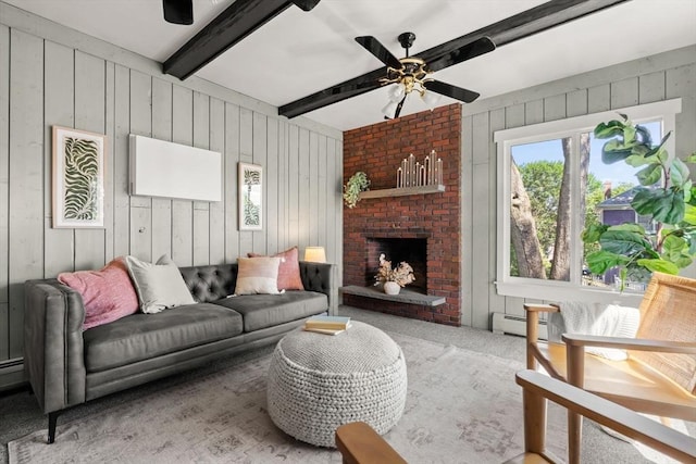 15 Newland Rd, Arlington, MA 02474 - carpeted living room with ceiling fan, wood walls, a baseboard heating unit, beamed ceiling, and a fireplace