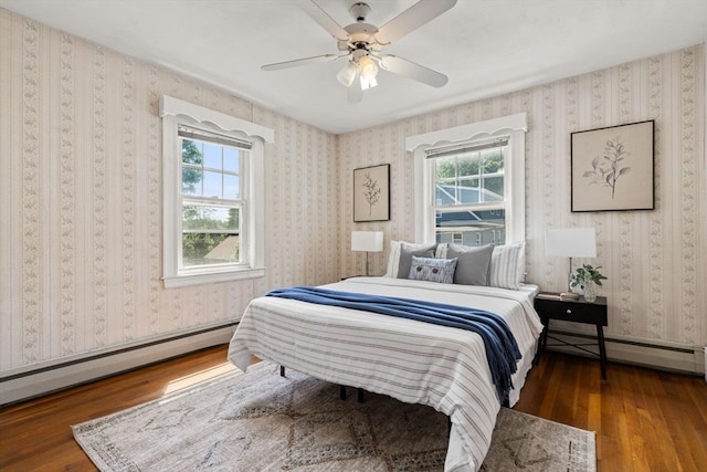 15 Newland Rd, Arlington, MA 02474 - bedroom with a baseboard heating unit, wood-type flooring, and a ceiling fan