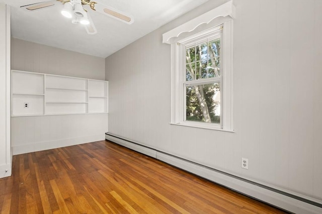 15 Newland Rd, Arlington, MA 02474 - unfurnished bedroom with a baseboard heating unit, hardwood / wood-style flooring, and a ceiling fan