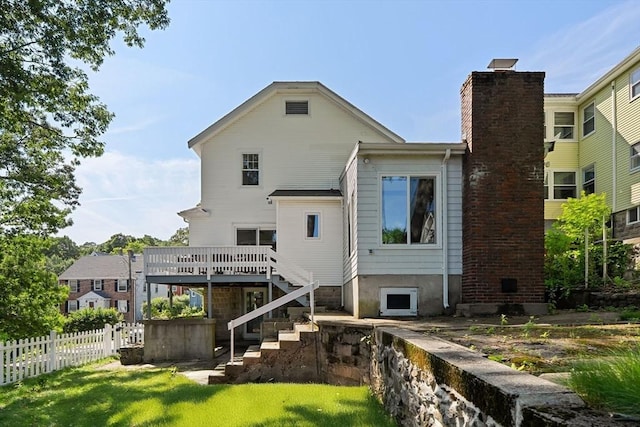 15 Newland Rd, Arlington, MA 02474 - back of property with stairway, a deck, and a chimney