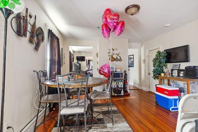 dining area featuring hardwood / wood-style floors