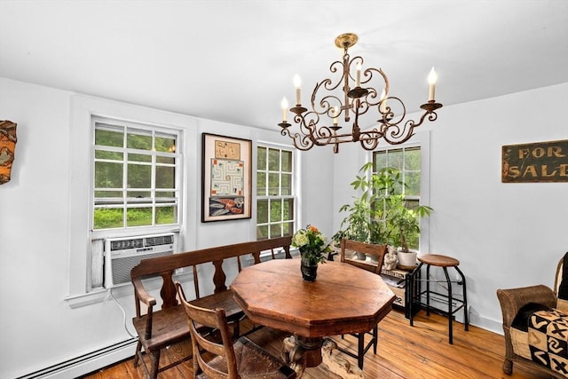 146 Chief Justic Cushing Hwy, Scituate, MA 02066 - dining room with baseboard heating, a chandelier, wood finished floors, and cooling unit
