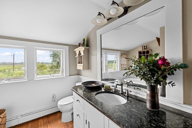 146 Chief Justic Cushing Hwy, Scituate, MA 02066 - bathroom with a baseboard heating unit, lofted ceiling, vanity, and wood finished floors