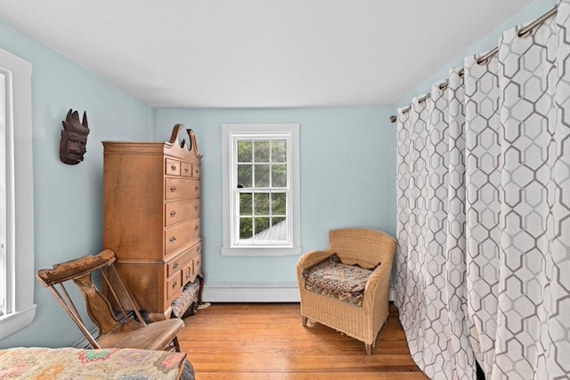 146 Chief Justic Cushing Hwy, Scituate, MA 02066 - living area with a baseboard radiator and light wood finished floors