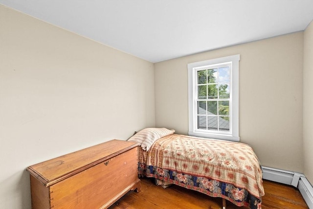 146 Chief Justic Cushing Hwy, Scituate, MA 02066 - bedroom featuring wood finished floors and a baseboard radiator
