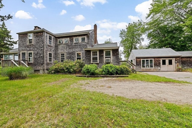 146 Chief Justic Cushing Hwy, Scituate, MA 02066 - back of property featuring a chimney, a yard, and cooling unit