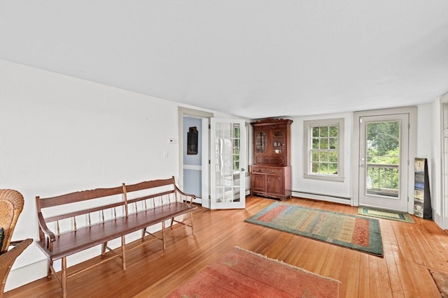 146 Chief Justic Cushing Hwy, Scituate, MA 02066 - entryway featuring baseboard heating and hardwood / wood-style flooring