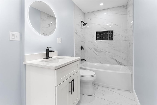 full bathroom featuring vanity, toilet, and tiled shower / bath