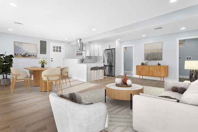 living room with light hardwood / wood-style flooring