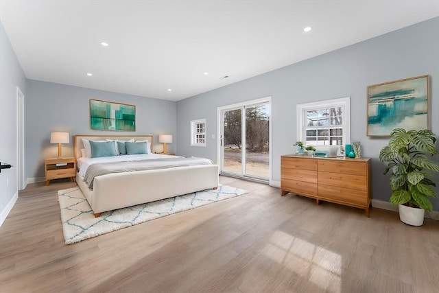 bedroom with access to outside and light wood-type flooring