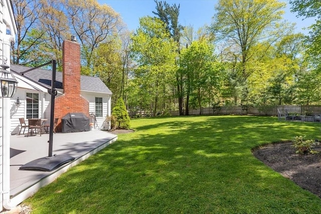 view of yard with a fenced backyard and a patio
