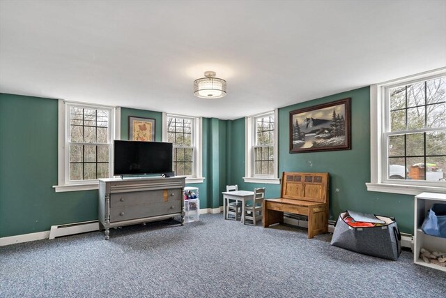 interior space featuring plenty of natural light, baseboards, and carpet floors