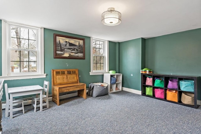 interior space featuring carpet flooring and baseboards